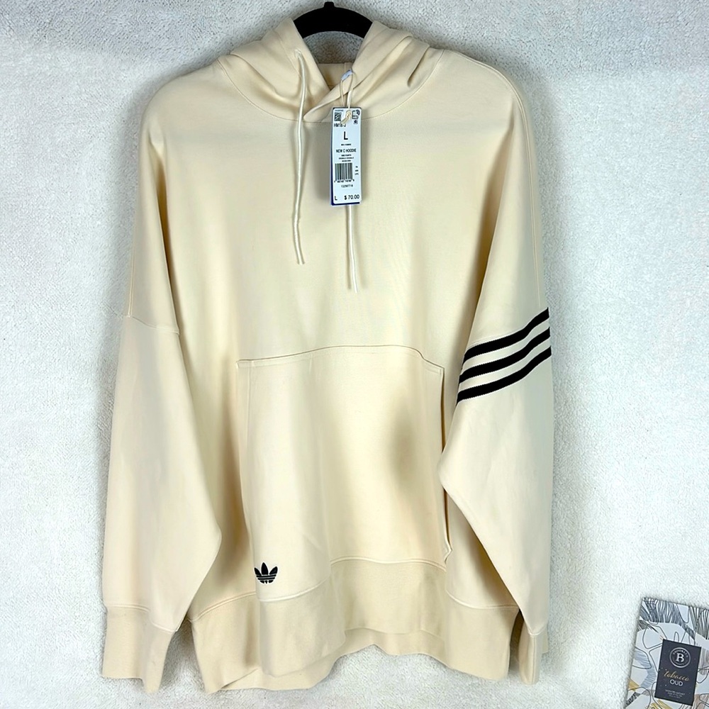 Brand new never worn Addias Stripe hoodie.